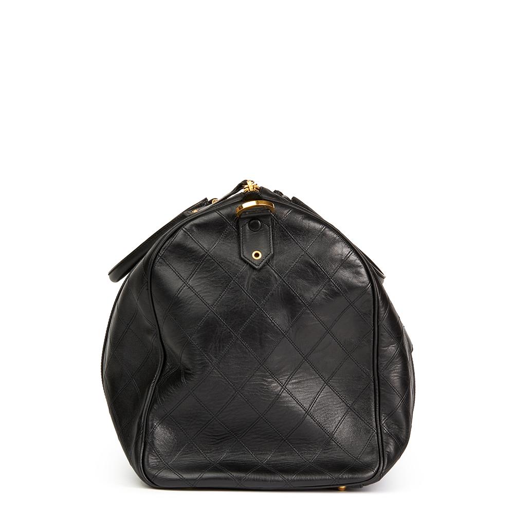 CHANEL
Black Quilted Lambskin Boston 50

 Reference: HB2232
Serial Number: 2800292
Age (Circa): 1994
Accompanied By: Chanel Dust Bag, Authenticity Card, Shoulder Strap
Authenticity Details: Serial Sticker, Authentity Card (Made in Italy)
Gender: