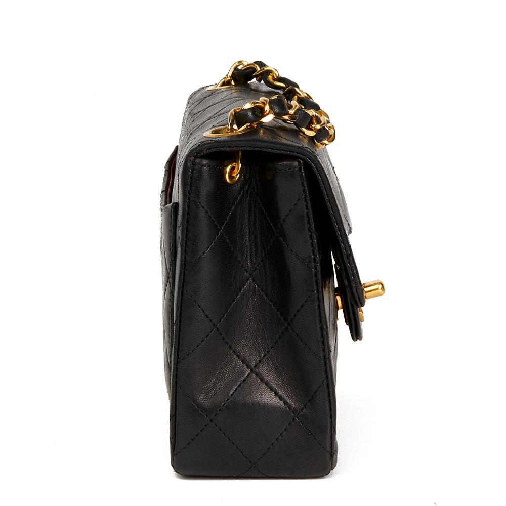 CHANEL
Black Quilted Lambskin Vintage Mini Flap Bag

 Reference: HB2224
Serial Number: 0629713
Age (Circa): 1986
Accompanied By: Chanel Dust Bag, Authenticity Card
Authenticity Details: Serial Sticker, Authenticity Card (Made in France)
Gender: