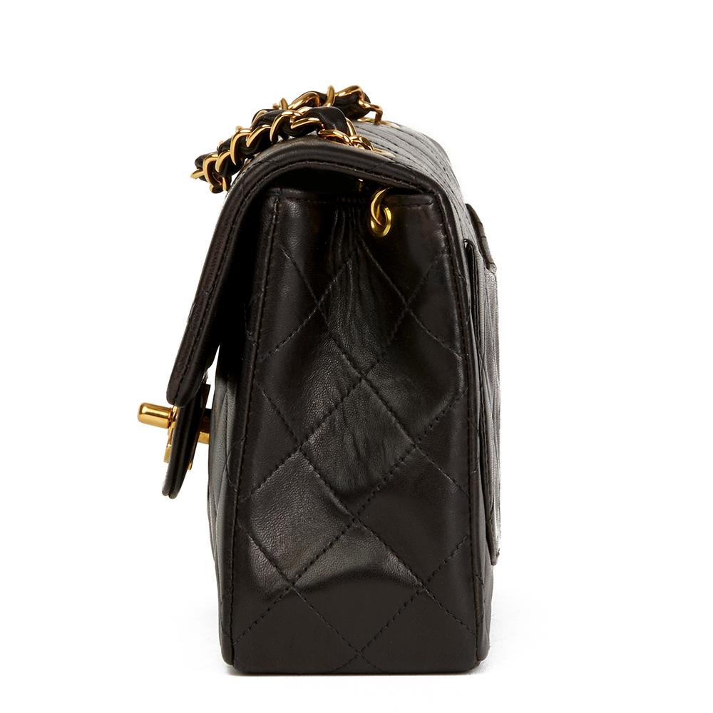 CHANEL
Black Quilted Lambskin Vintage Mini Flap Bag

 Reference: HB2223
Serial Number: 3162760
Age (Circa): 1994
Accompanied By: Chanel Dust Bag, Authenticity Card, Care Booklet
Authenticity Details: Serial Sticker, Authenticity Card (Made in