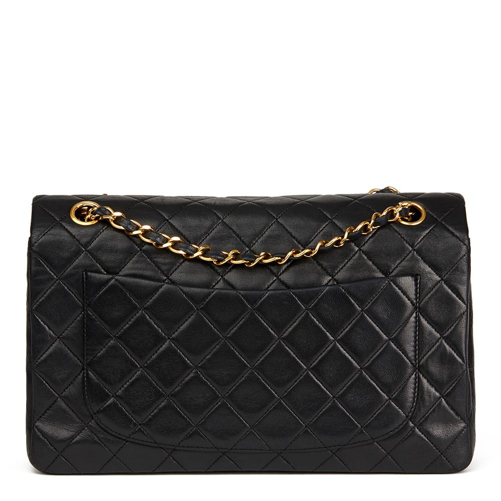 CHANEL
Black Quilted Lambskin Vintage Tall Classic Single Flap Bag with Wallet

 Reference: HB2219
Serial Number: 1407522
Age (Circa): 1991
Accompanied By: Chanel Dust Bag, Box, Authenticity Card
Authenticity Details: Serial Sticker, Authenticity