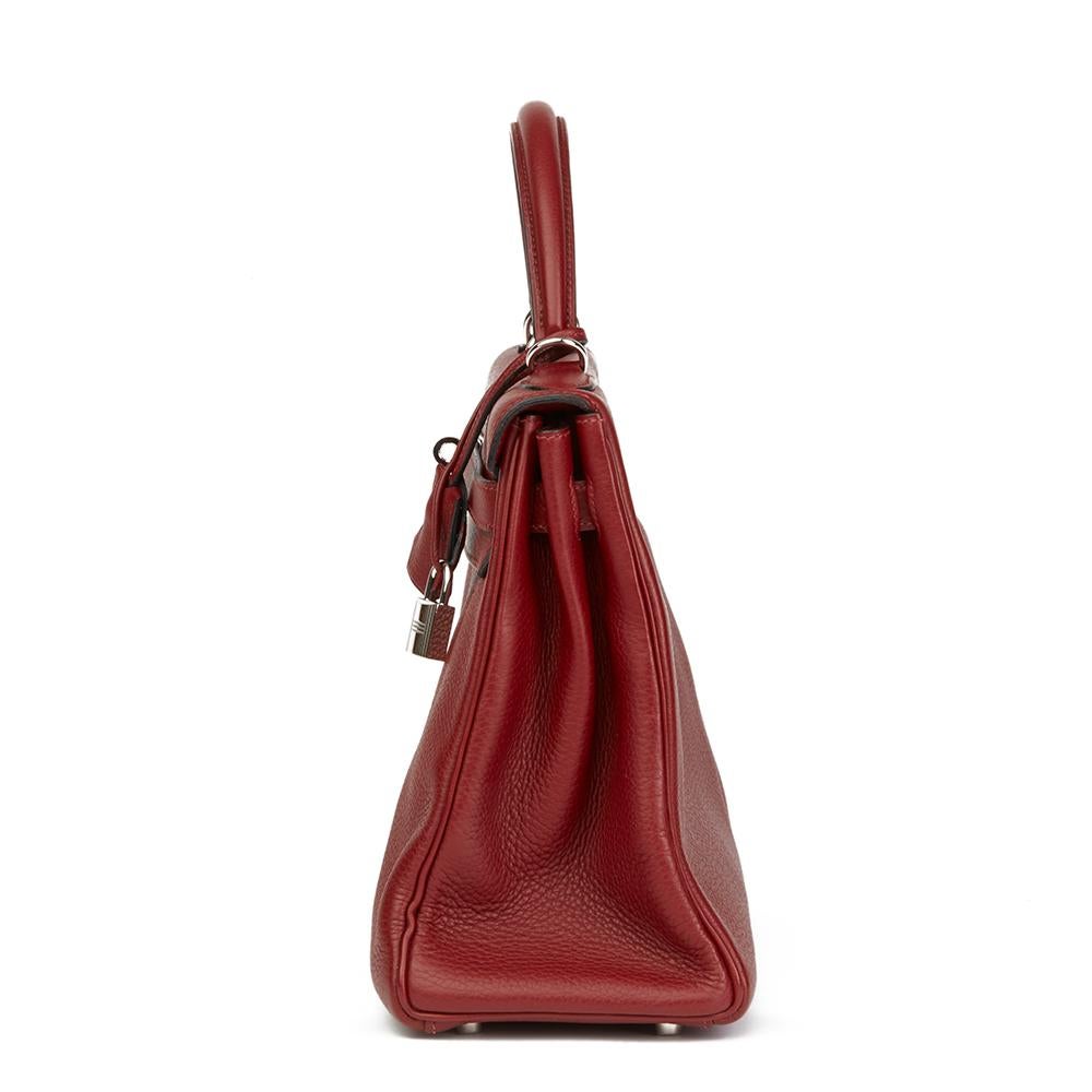 HERMÈS
Rouge H Clemence Leather Kelly 32cm Retourne

 Reference: HB2217
Serial Number: [J]
Age (Circa): 2006
Accompanied By: Hermès Dust Bag, Box, Lock, Keys, Clochette, Shoulder Strap, Care Booklet
Authenticity Details: Date Stamp (Made in