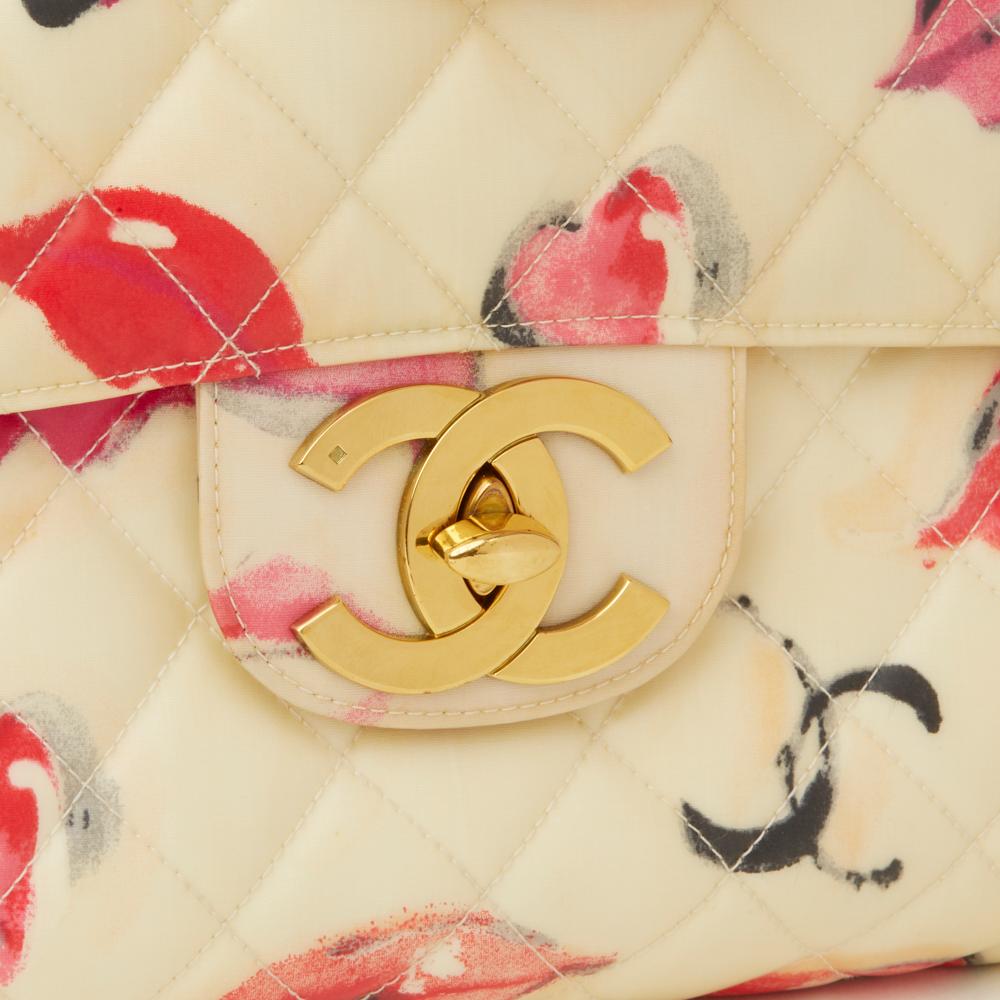 CHANEL
Beige Quilted PVC 'Lips & Kisses' Vintage Maxi Jumbo XL Flap Bag
 Reference: HB2252
Serial Number: 3356804
Age (Circa): 1994
Accompanied By: Authenticity Card, Care Booklet
Authenticity Details: Serial Sticker, Authentity Card (Made in