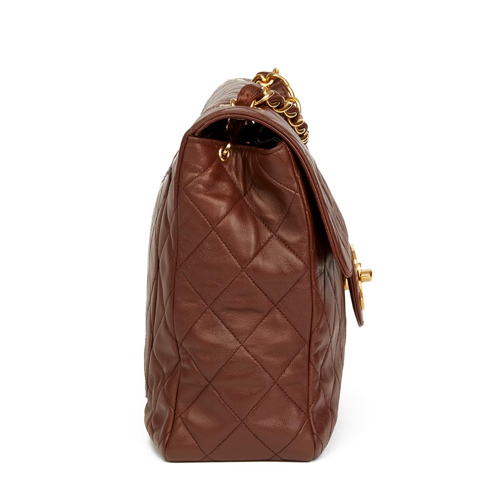 CHANEL
Brown Quilted Lambskin Vintage Jumbo XL Soft Flap Bag

 Reference: HB2126
Serial Number: 3596023
Age (Circa): 1996
Accompanied By: Authenticity Card, Care Booklet
Authenticity Details: Serial Sticker, Authenticity Card (Made in