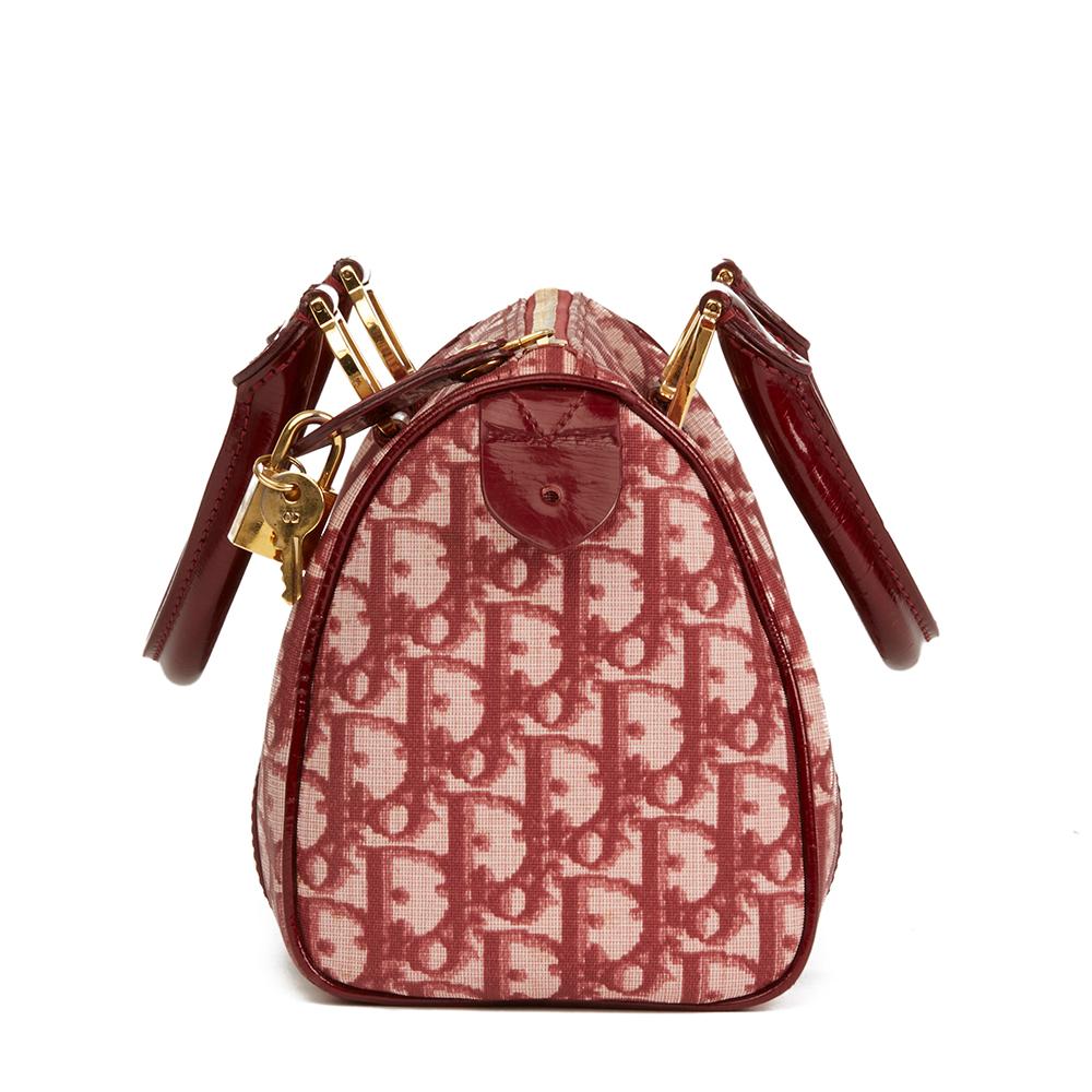 CHRISTIAN DIOR
Red Monogram Canvas Boston 20cm

 Reference: HB2281
Serial Number: BO C 0061
Age (Circa): 2001
Accompanied By: Padlock, Keys
Authenticity Details: Date Stamp (Made in Italy)
Gender: Ladies
Type: Tote

Colour: Red
Hardware: