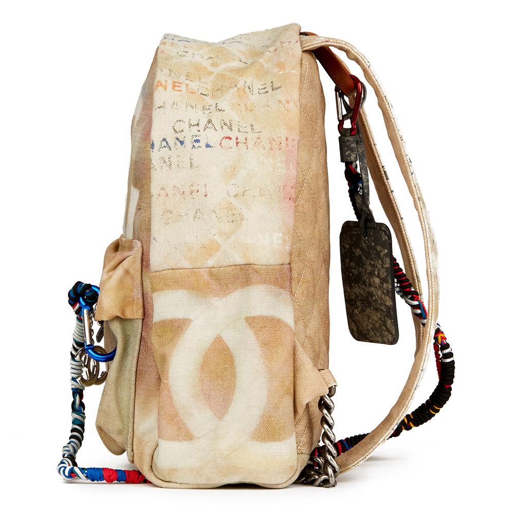 CHANEL
Beige Painted Canvas Medium Graffiti Backpack 

 Reference: HB2291
Serial Number: 19315721
Age (Circa): 2014
Accompanied By: Authenticity Card
Authenticity Details: Serial Sticker, Authentity Card (Made in France)
Gender: Ladies
Type: