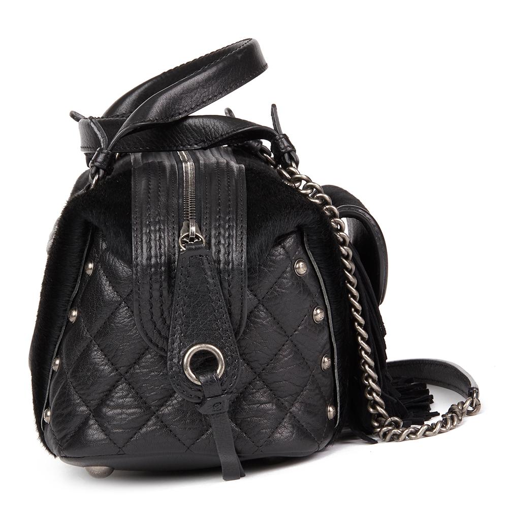 CHANEL
Black Quilted Calfskin, Suede & Pony Fur Paris-Dallas Boston Bag

Reference: HB2333
Serial Number: 19596381
Age (Circa): 2014
Accompanied By: Chanel Dust Bag, Authenticity Card
Authenticity Details: Serial Sticker, Authenticity Card (Made in
