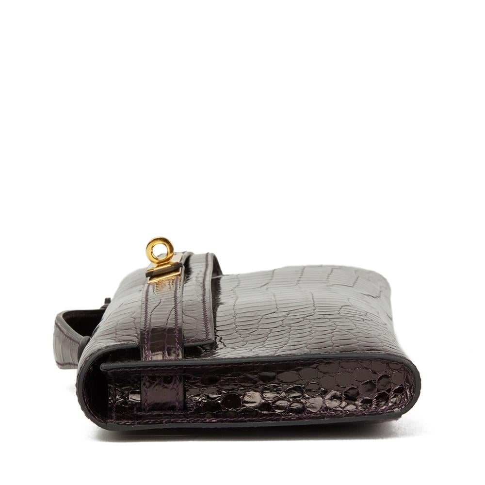 HERMÈS
Aubergine Shiny Porosus Crocodile Leather Kelly Cut

Reference: CB143
Serial Number: X
Age (Circa): 2016
Accompanied By: Hermès Dust Bag
Authenticity Details: Date Stamp (Made in France)
Gender: Ladies
Type: Clutch, Top Handle

Colour: