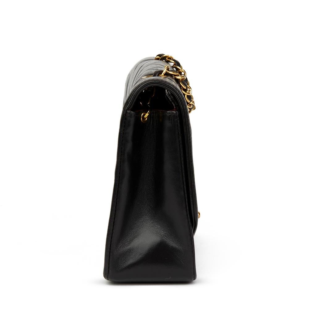 CHANEL
Black Quilted Lambskin Vintage Medium Diana Classic Single Flap Bag

Reference: HB2363
Serial Number: 2527749
Age (Circa): 1993
Accompanied By: Chanel Dust Bag, Authenticity Card
Authenticity Details: Serial Sticker, Authenticity Card (Made