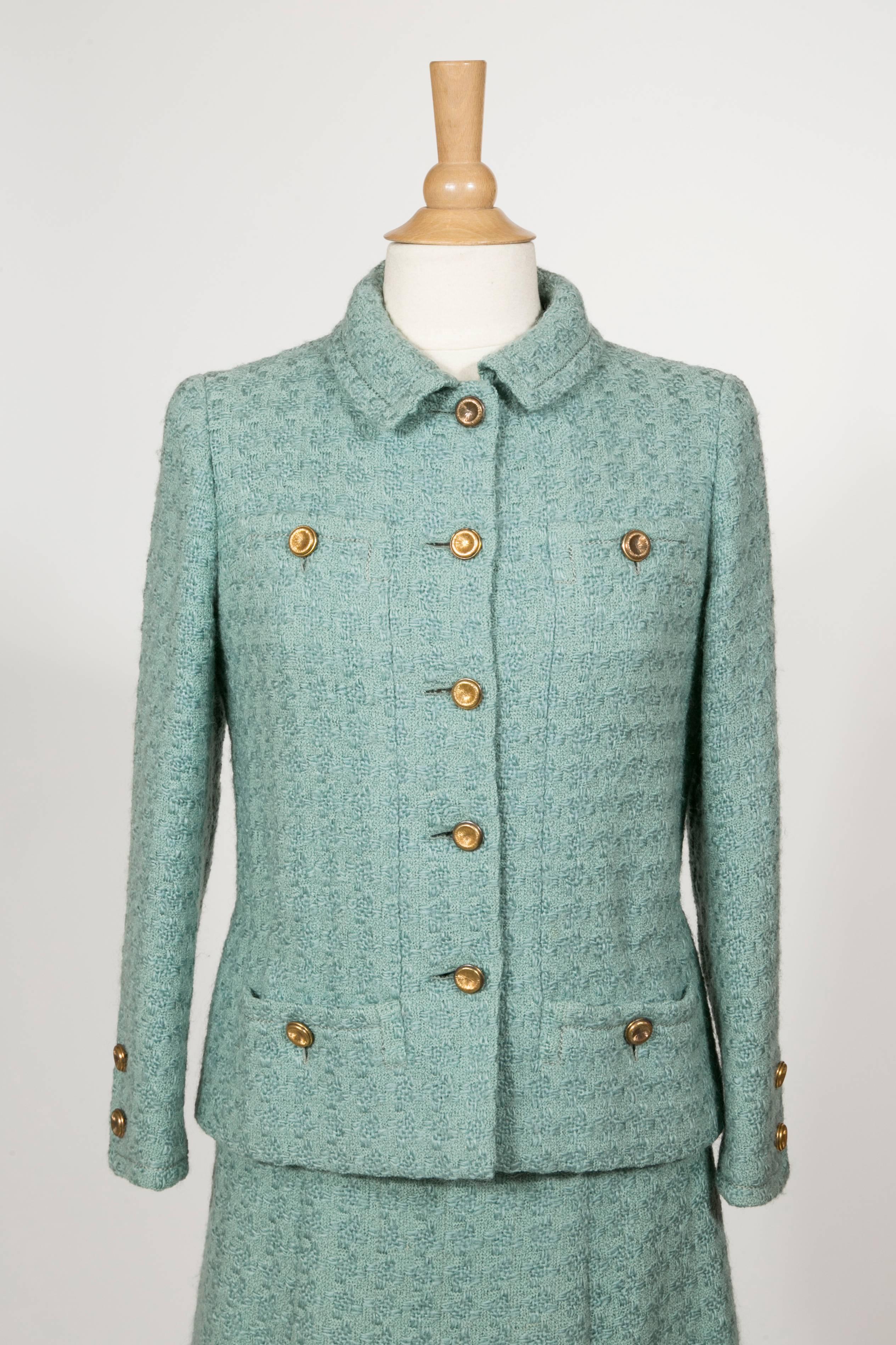 1960 Rare Celadon Chanel Haute -Couture Suit :
The jacket is a 4 pockets typical Coco Chanel 'signature , silk lining quilt with the chaine . the boutons are golden brass .
The Skirt is straight with the classic shame and also the  silk lining quilt