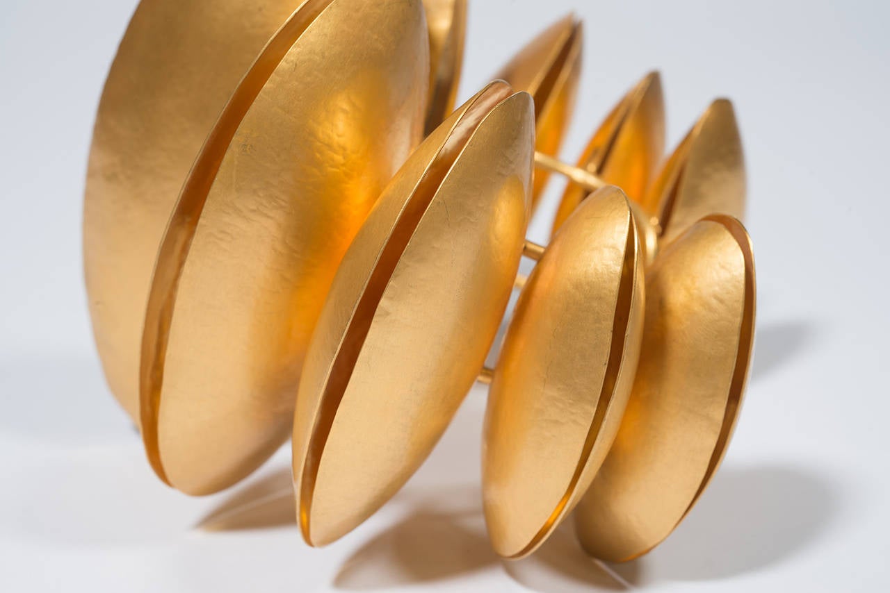 Herve Van Der Straten stunning bracelet in golden brass inspired by the famous sculptor Brancusi  . This amazing bracelet look like a African ornament .
This cuff includes 9 elements and are fixed on a double ring .
Elements look like huge seeds