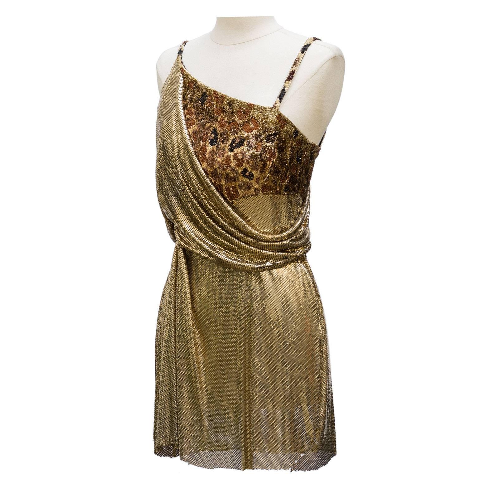 1994 Gianni Versace Haute Couture Stunning Evening Metallic Dress 
mini couture cocktail dress has straps.
The bustier is the strapless velvet gold lame leopard print .
the skirt, the back and the sheets are golden metallic mesh .There are some