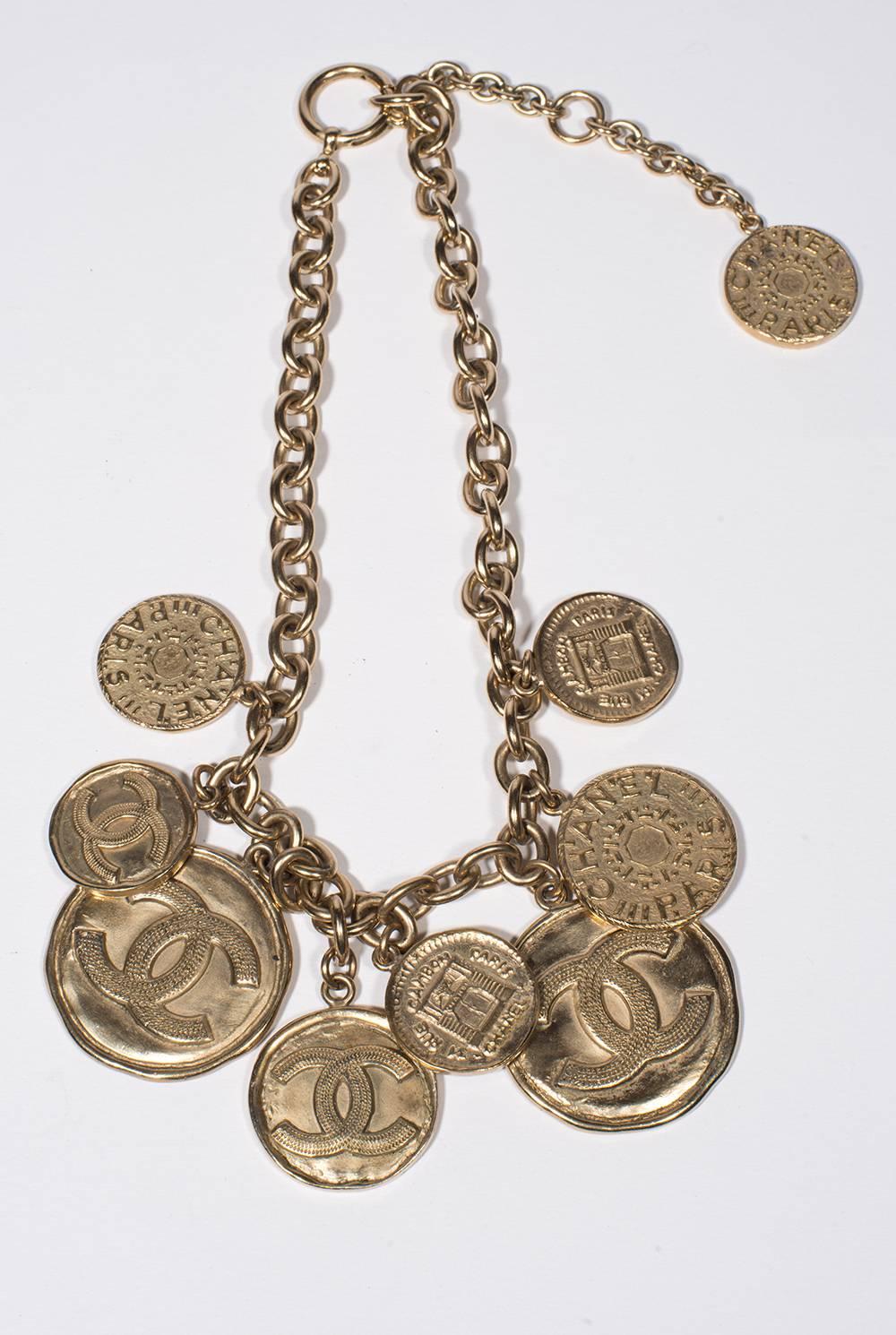 2000 Chanel Amazing  Medals Necklace 
Amazing medals necklace on side with the double C and the other side with 
Coco Chanel face or the symbols of the Rue Cambon .
You have 8 medals the 2 bigger are 4 cm after 2 medium 3 cm and the 4 small