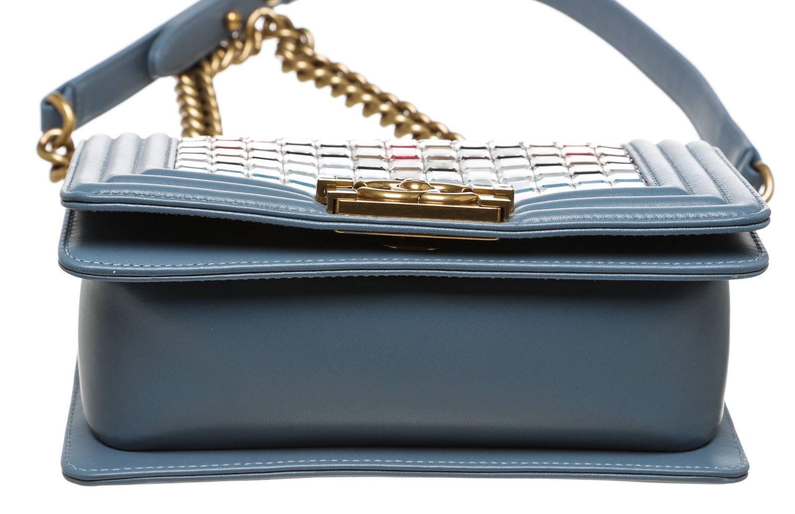 Designer: Chanel
Type: Handbag
Condition: Excellent
Color: Blue with Multicolor Mosaic
Material: Leather
Dimensions: 8