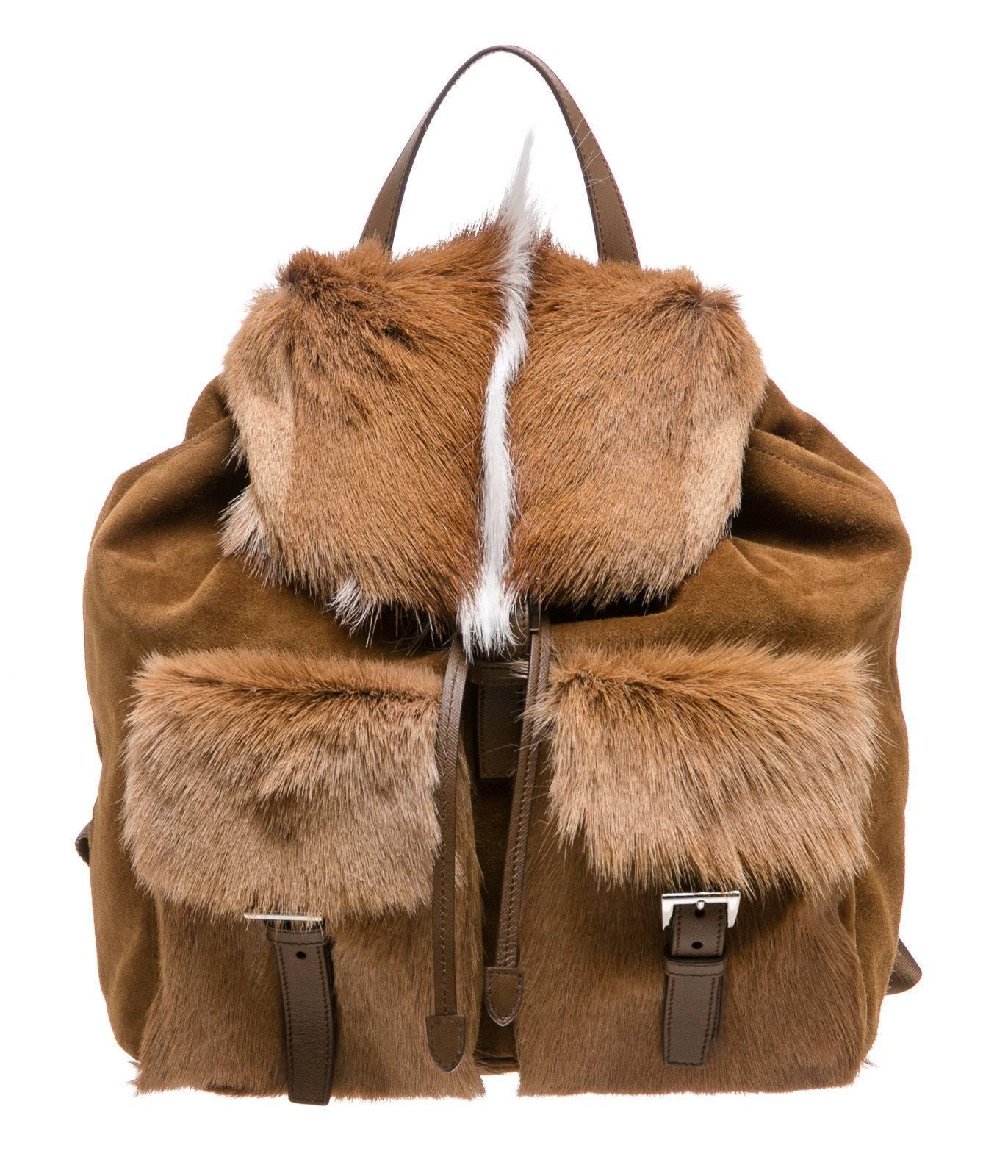 Designer: Prada
Type:
Handbag
Condition:
Exterior: Pre-owned in very good condition - faint scuffs
Interior: Pre-owned in excellent condition
Color:
Brown/White
Material:
Suede/Fur
Dimensions:
11.5