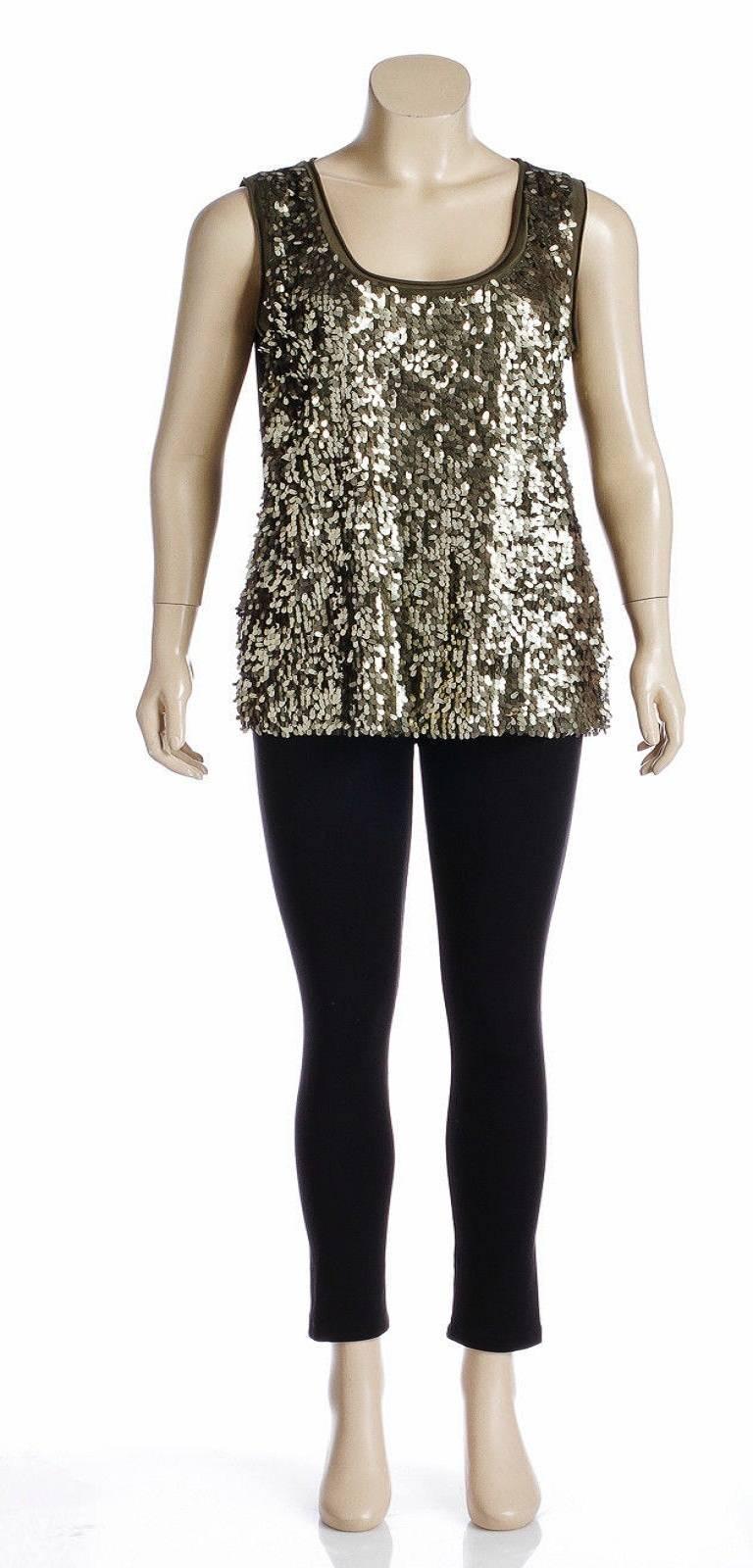  Shine like the star you are in this one of a kind top by Calvin Klein! This gorgeous top features a scoop neck and the front is covered with sparkling sequins that is sure to catch some attention! You can wear with a sharp blazer for a fun office