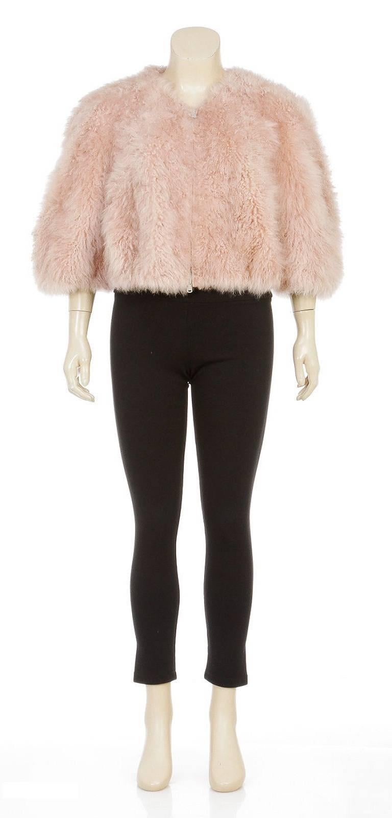 Flaunt your fabulous fashion sense with this amazing jacket by the one and only Brunello Cucinelli! This rose colored jacket makes for an incredibly extravagant wear as it is constructed from sheepskin. You won't be able to keep your hands off of