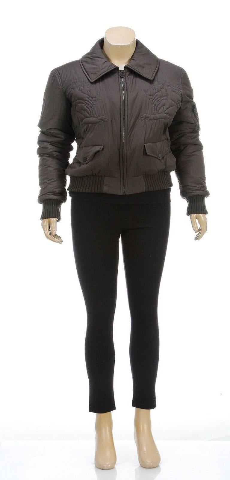 Featured here is a beautifully made Chanel jacket to give your look an extra flash of fashion! This super soft jacket contains ribbed contrasts at the  hemline and cuffs. It zips up the front as two flap pockets snap closed in the front. A CC is