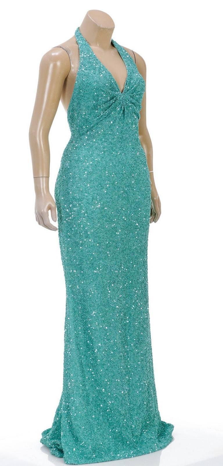 Designer: Other
Type: 
Dress
Condition: 
NEW (Sample)
Color: 
Aqua
Material: 
97% Silk, 3% Spandex
Dimensions: 
Bust: 28
