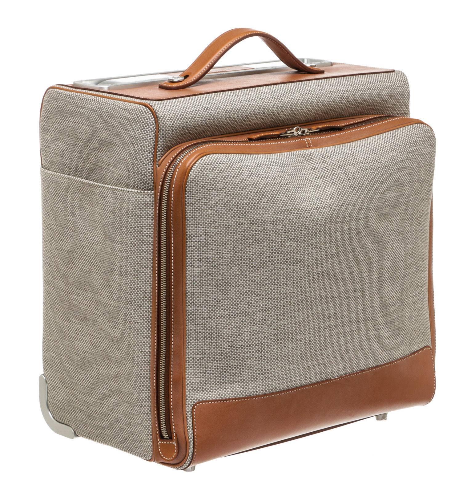 Designer: Hermes
Type: Luggage
Condition: New
Color: 
Beige/Tan
Material: 
Fabric/Leather
Dimensions: 
Description: 
Silver-tone hardware
Sku: 205821