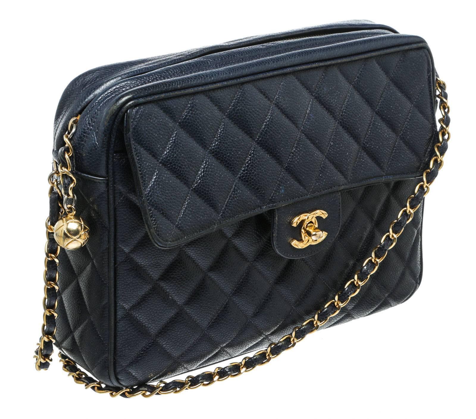 Designer: Chanel
Type: 
Handbag
Condition: 
Exterior: Pre-owned in very good condition - scruffs on hardware/trim wear
Interior: Pre-owned in very good condition - minor wear/minor marks
Color: 
Navy
Material: 
Caviar Leather
Dimensions: