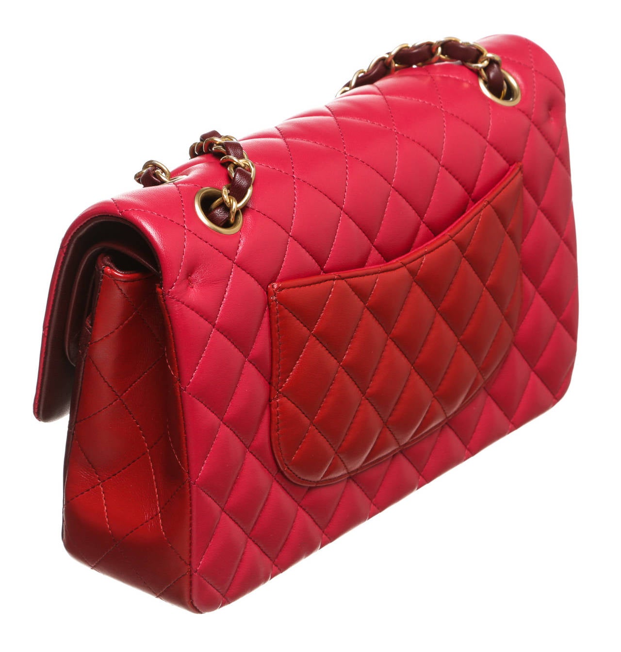 One of the most fabulous Chanel handbags has made its way into our store and it's about to make its way into your heart. This is an amazing Chanel 2.55 medium handbag colored in complementary pink, burgundy, and red. This is quickly becoming an
