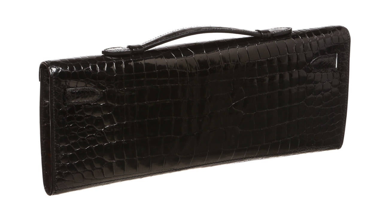 Make a statement with this highly coveted Hermes Kelly Cut clutch! Perfect for your A-List events out on the town, this gorgeous handbag will get you to the top of that best dressed list! Carefully and skillfully constructed of exotic Porosus