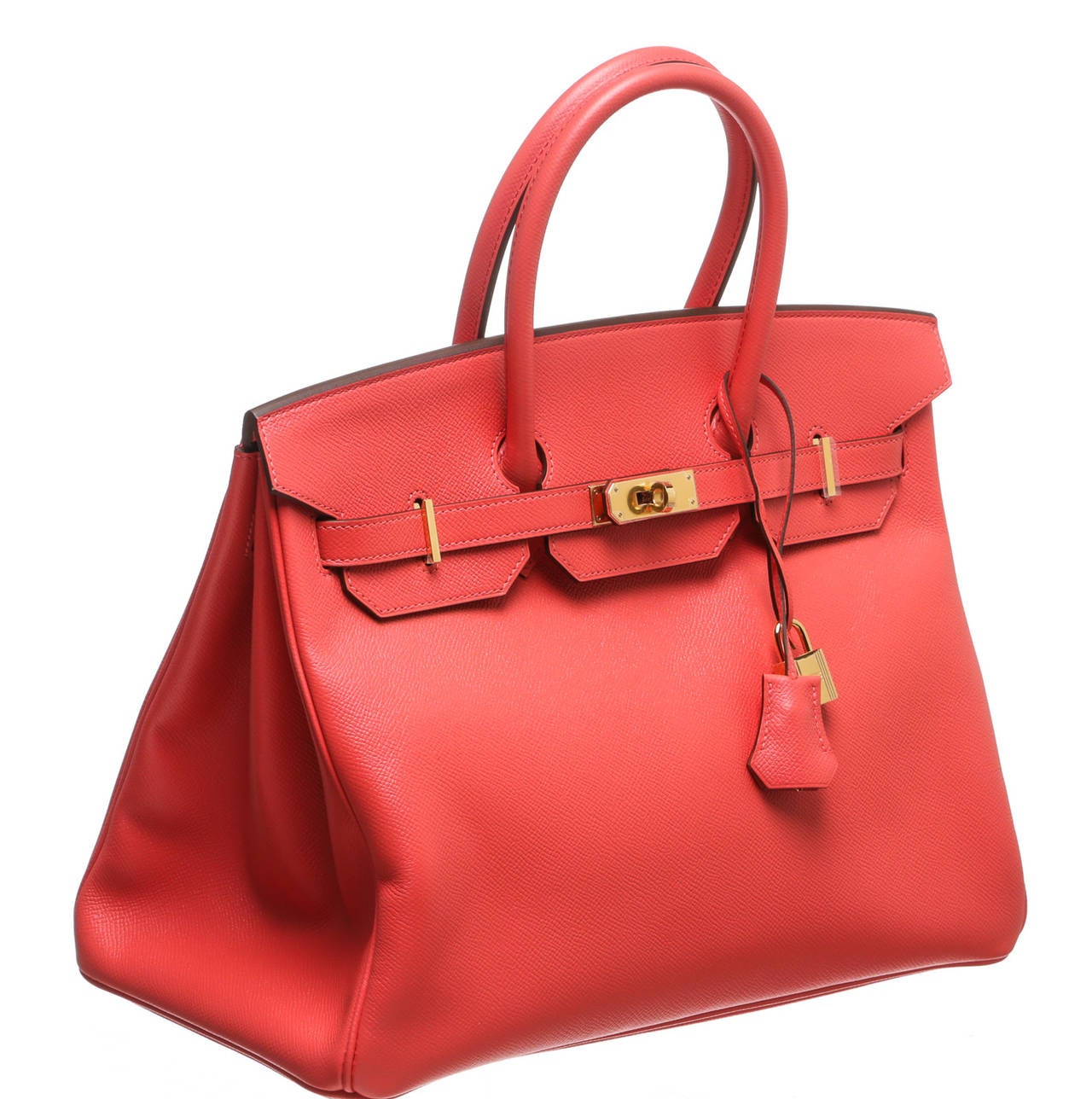 This gorgeous 35cm Birkin has been crafted from Rouge Pivoine epsom leather which is noted for rich texture and durability. This Birkin also features polished gold tone hardware. The interior is lined in luxurious leather in matching color. The
