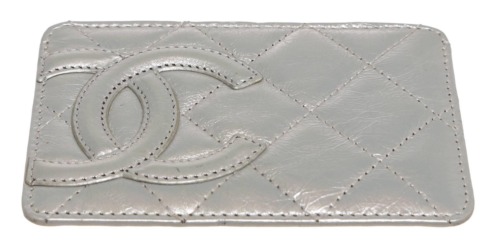 Featured is a Chanel card holder.