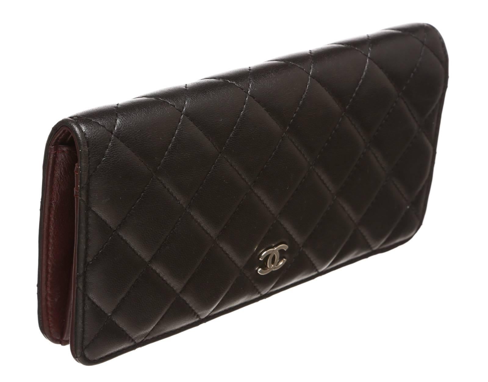 Featured is a Chanel quilted leather wallet.