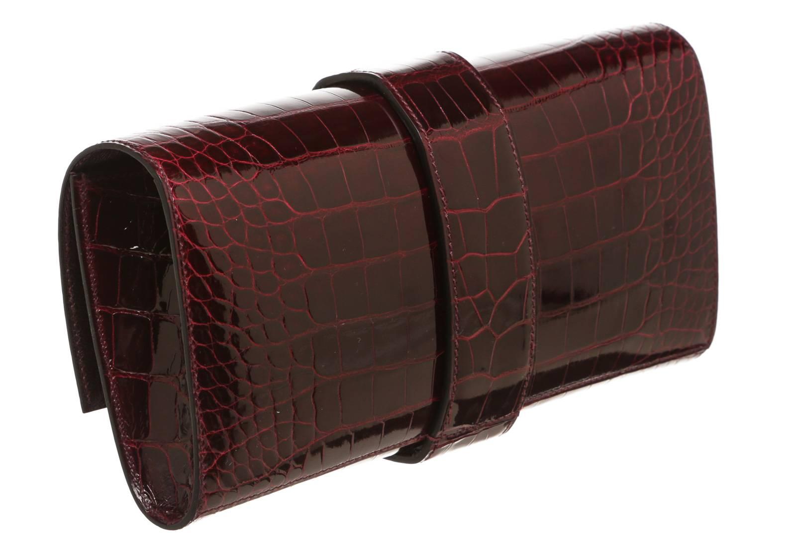 A clutch is a staple, but this Medor features a decadent design that shouts Hermes. Crafted with a stunning burgundy alligator, it contains palladium hardware and a collier de chien closure in the front. The rounded design is comfortable to carry,