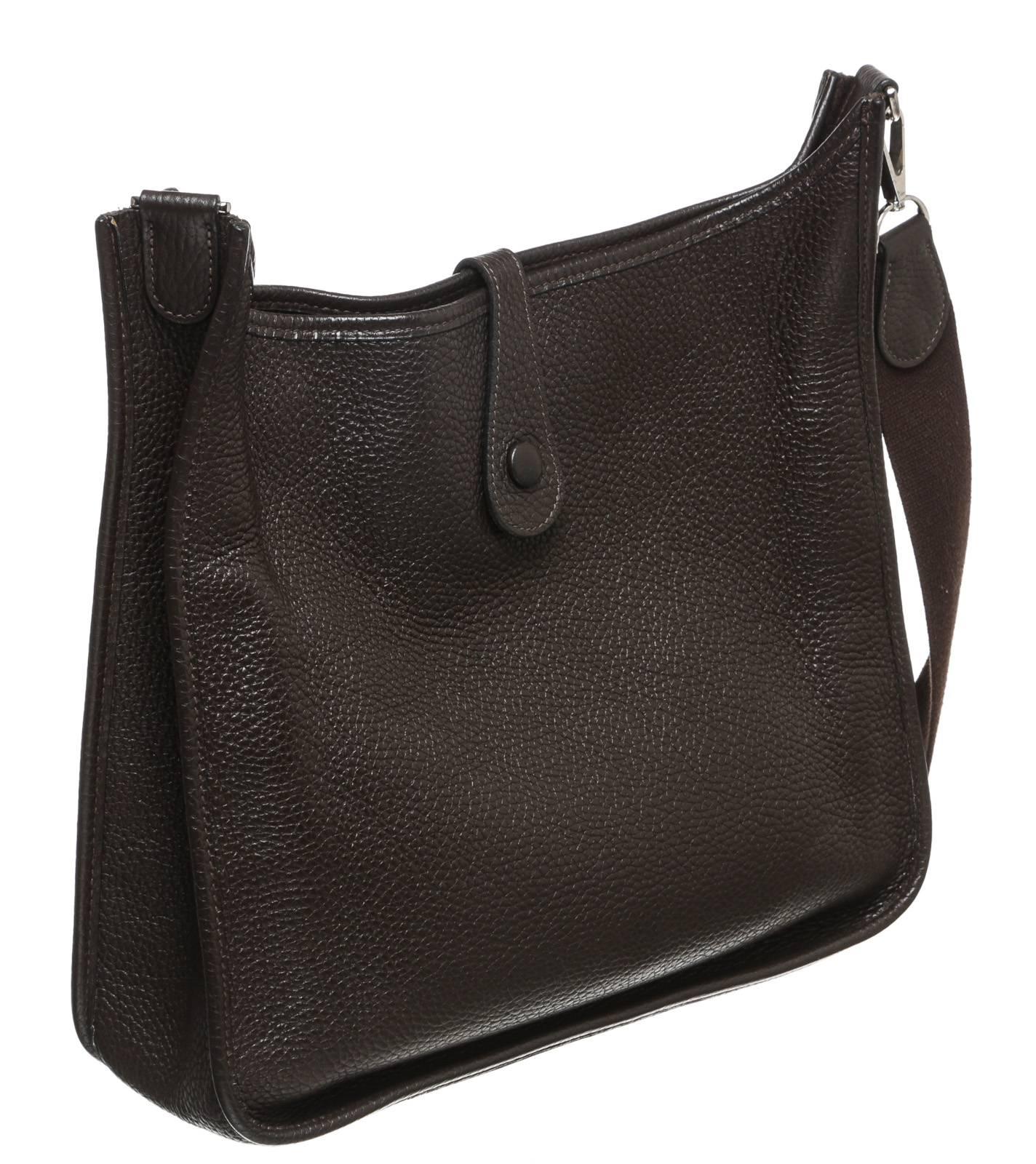 This handbag features a long shoulder strap, which makes this bag perfect for carrying over the shoulder or cross body. A large perforated leather 