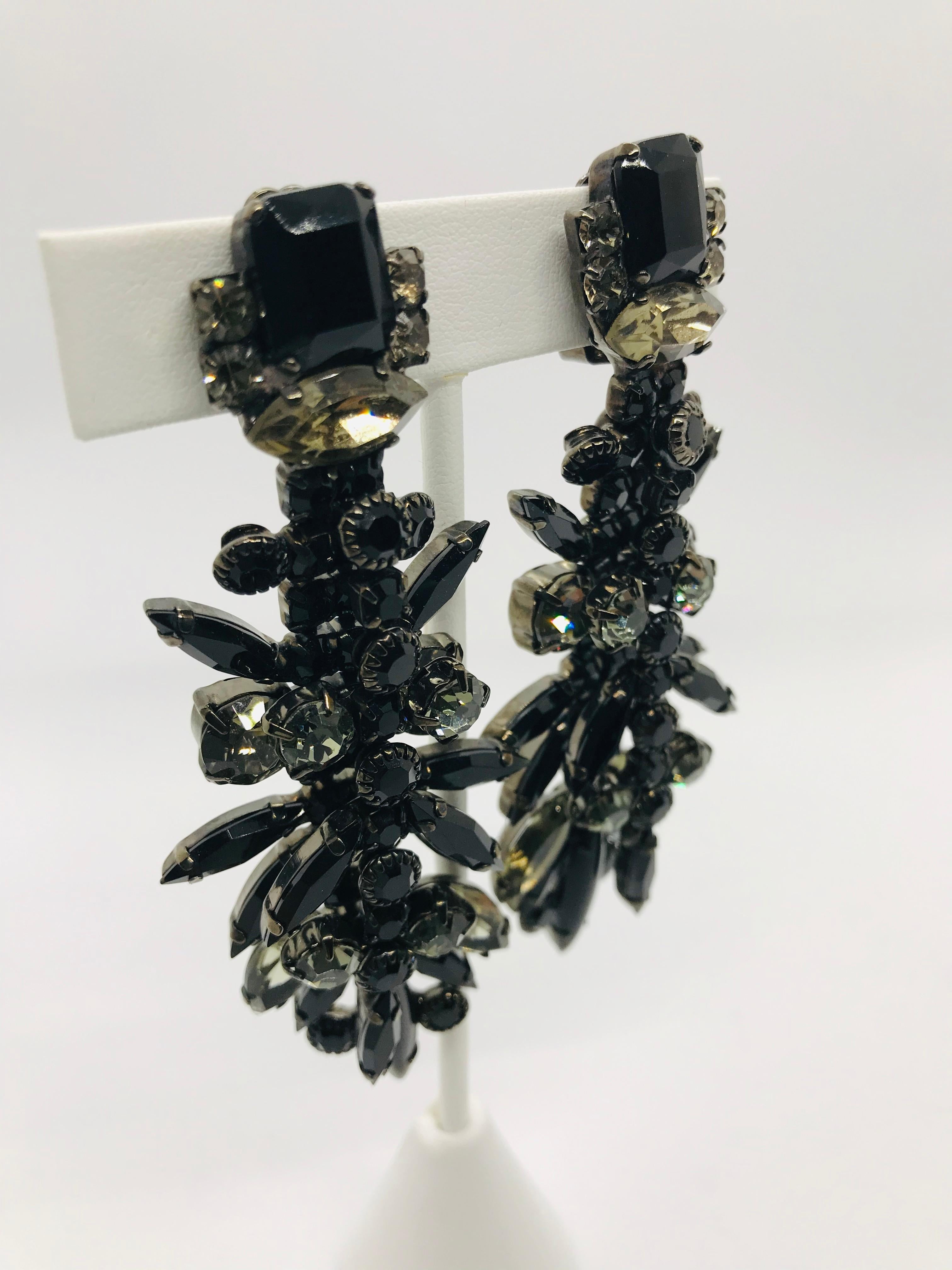 These elegant and dramatic black jet and black diamond vintage 1960s Austrian crystal chandelier earrings are sure to add a glamourous touch to any look!  These chandelier earrings are double layered for extra movement and glitter.  The earrings are