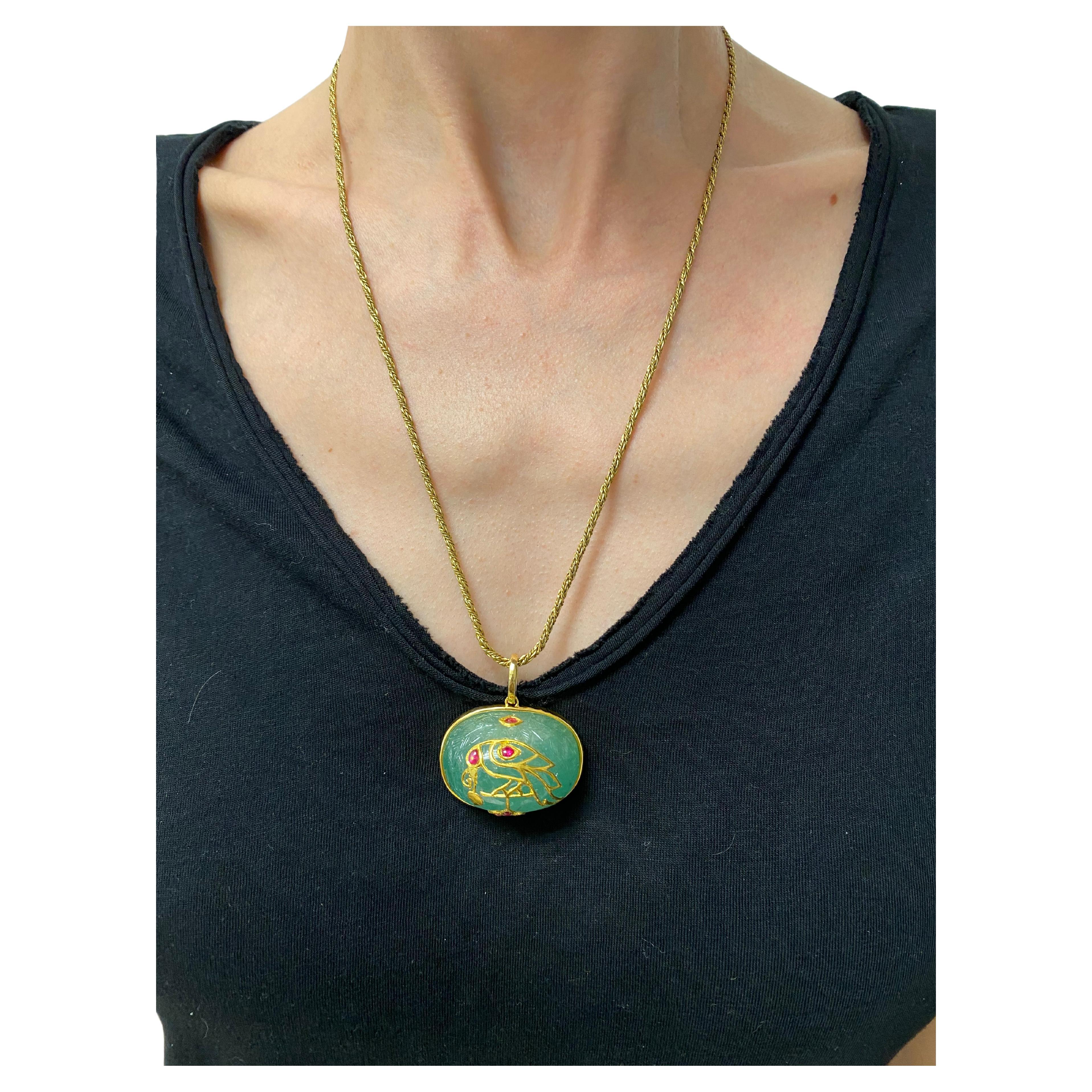 Product details:
Featuring 14K yellow gold, floral motif carved emerald with ruby detail and 10K yellow gold Victorian twisted rope chain necklace.
The pendant measure 1-5/8” W x 1” L x 3/4” H. 30.3 grams.
The chain measure 22- ½” long and 3mm wide.