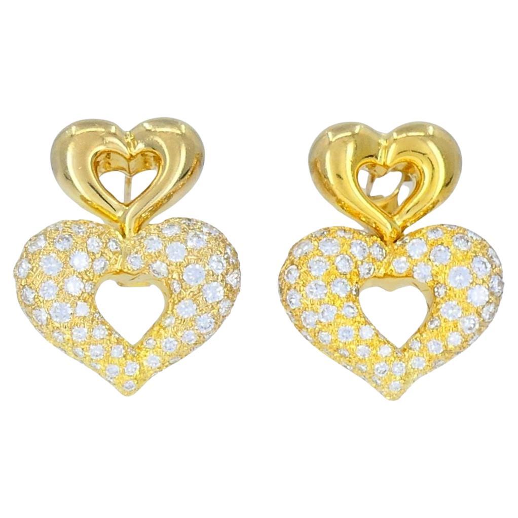 Vintage Van Cleef & Arpels Boucles d'oreilles double cœur en or 18k et diamants
