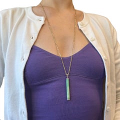 Collier Art déco avec pendentif en jade, platine et diamants, muni d'une chaîne en or 14 carats