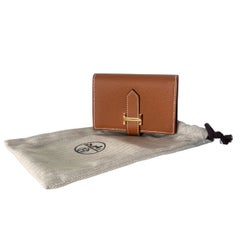 Cartera compacta Hermès Béarn de piel Epsom dorada con herrajes dorados