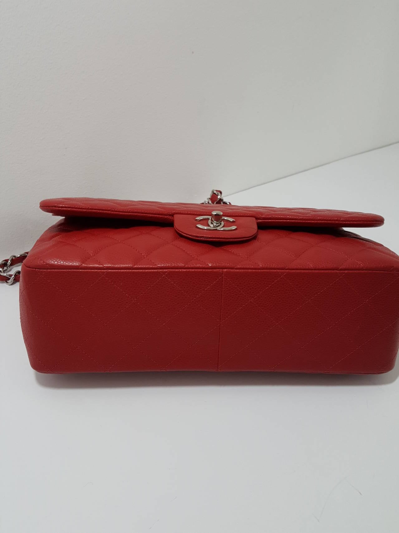 Women's Chanel Red Caviar Jumbo Double Flap with Silver Hardware.