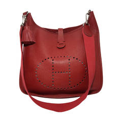 Gorgeous Rouge Hermes Evelyn II GM shoulder bag with leather tassel.