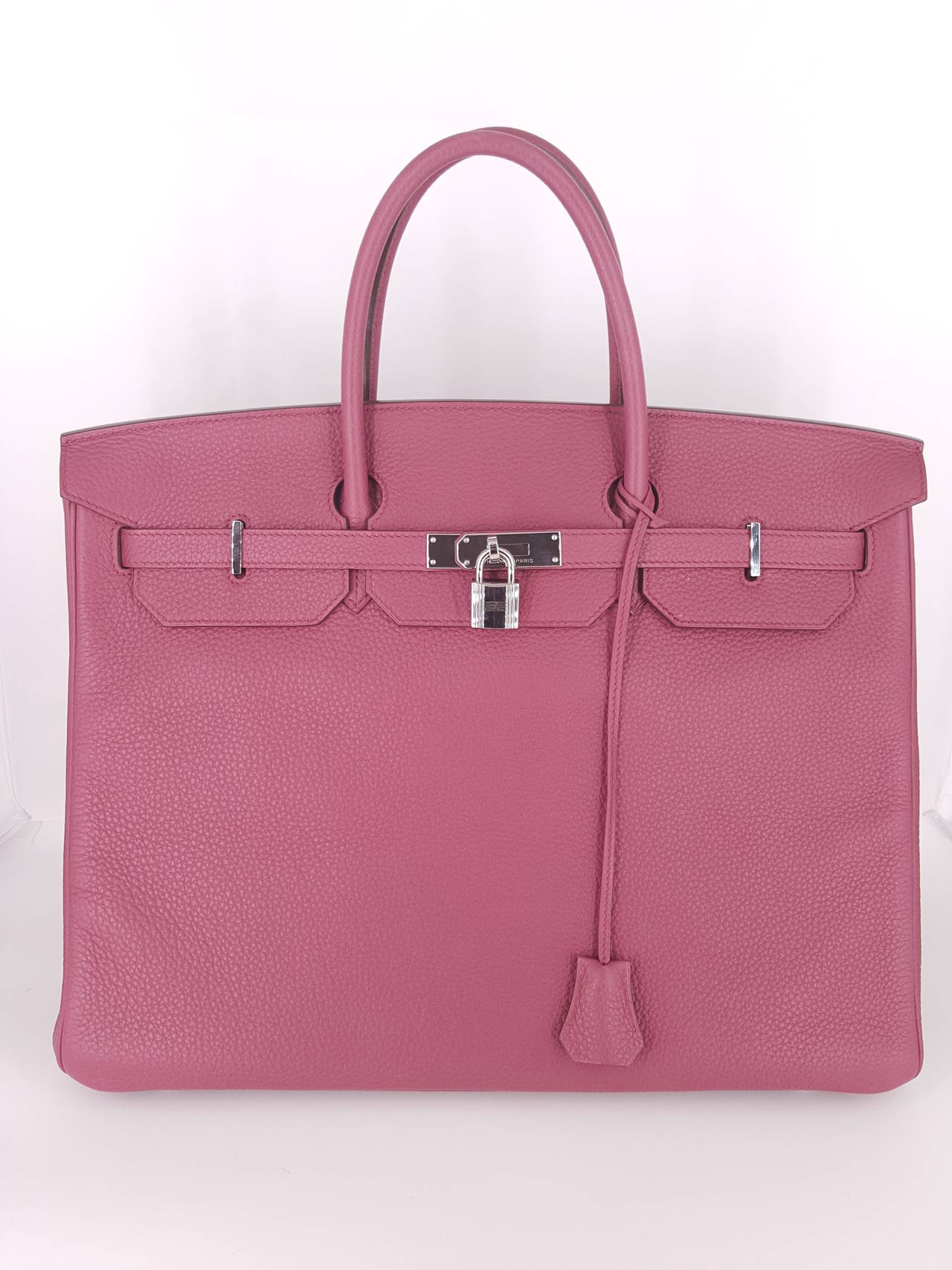 This Authentic Hermes 40 Cm Birkin is in Pristine Condition.  Hermes bags are sought after worldwide and difficult to obtain.  The subtle Rose color is exceptional in Clemence leather and Palladium hardware.  This bag was purchased in early 2012