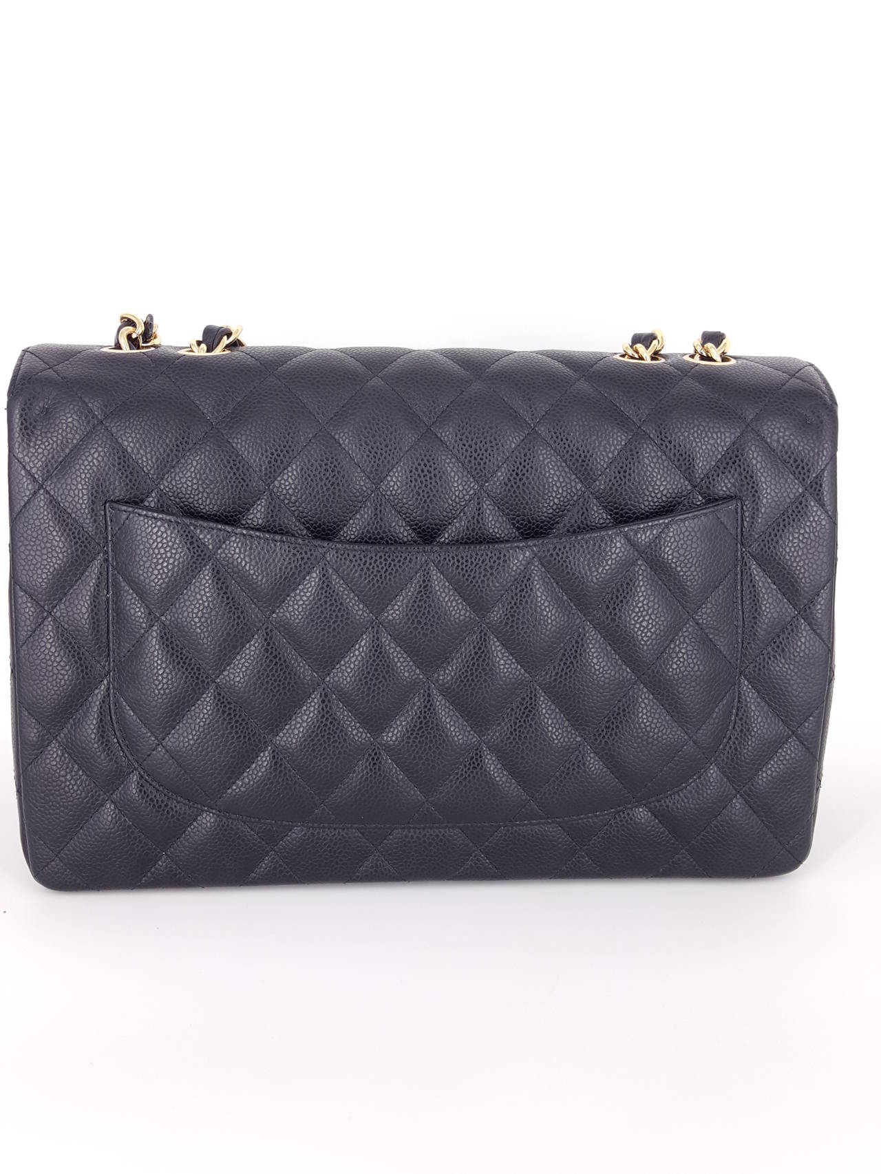 Offered for sale is a Very gently worn Chanel XL Jumbo single Flap in beautiful caviar with gold hardware.  This beautiful and timeless classic from 2006, has only been gently carried,  No signs of wear and the hardware is bright and  in excellent