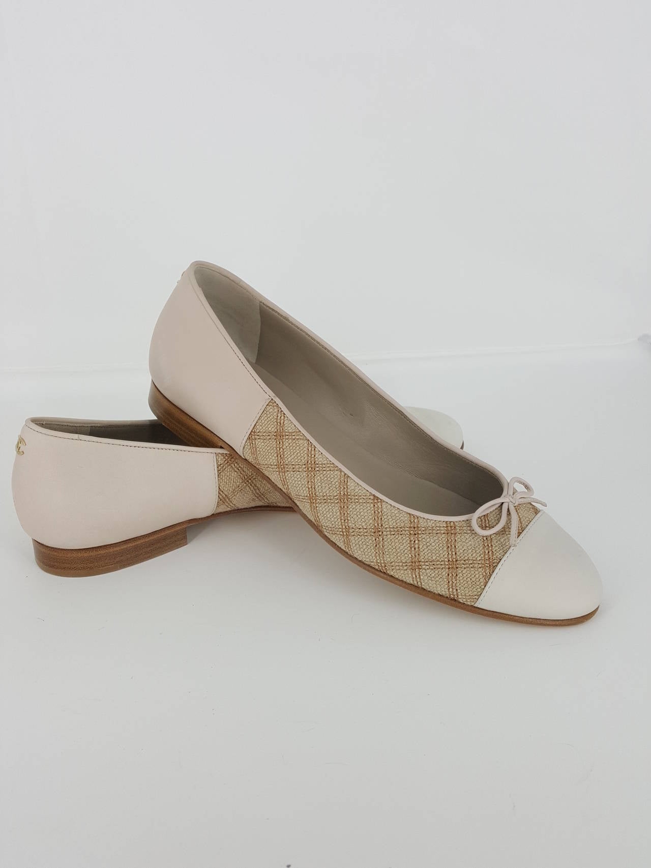 Offered for sale are these darling Bone and Beige CHANEL Ballet Flats is size 38 ( 7 1/2).  The Beige fabric sides have that definite CHANEL look.  on the heel is a tiny cc.  In almost new condition, these are a must for any wardrobe.
These will