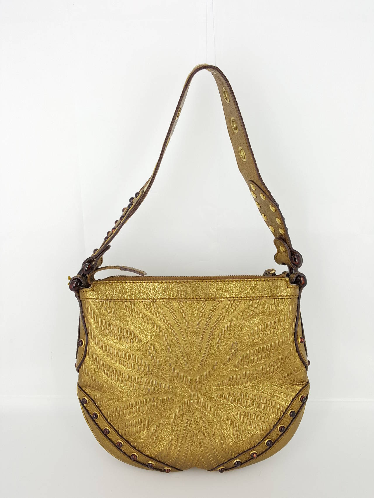 Offered for sale is this limited edition Gucci Pelham small hobo with tortoise glass cabochon embellishments.  This has  never been carried and is in excellent condition.  Thee embossed leather and the glass stones make this a stunning bag.  The