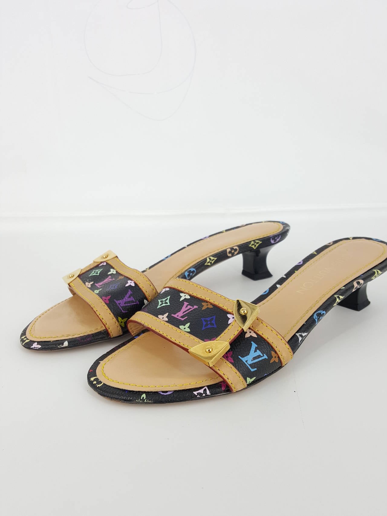 Offered for sale are these darling Louis Vuitton Monogram Multicolor slide shoes in size  8.  These have a 1 3/4