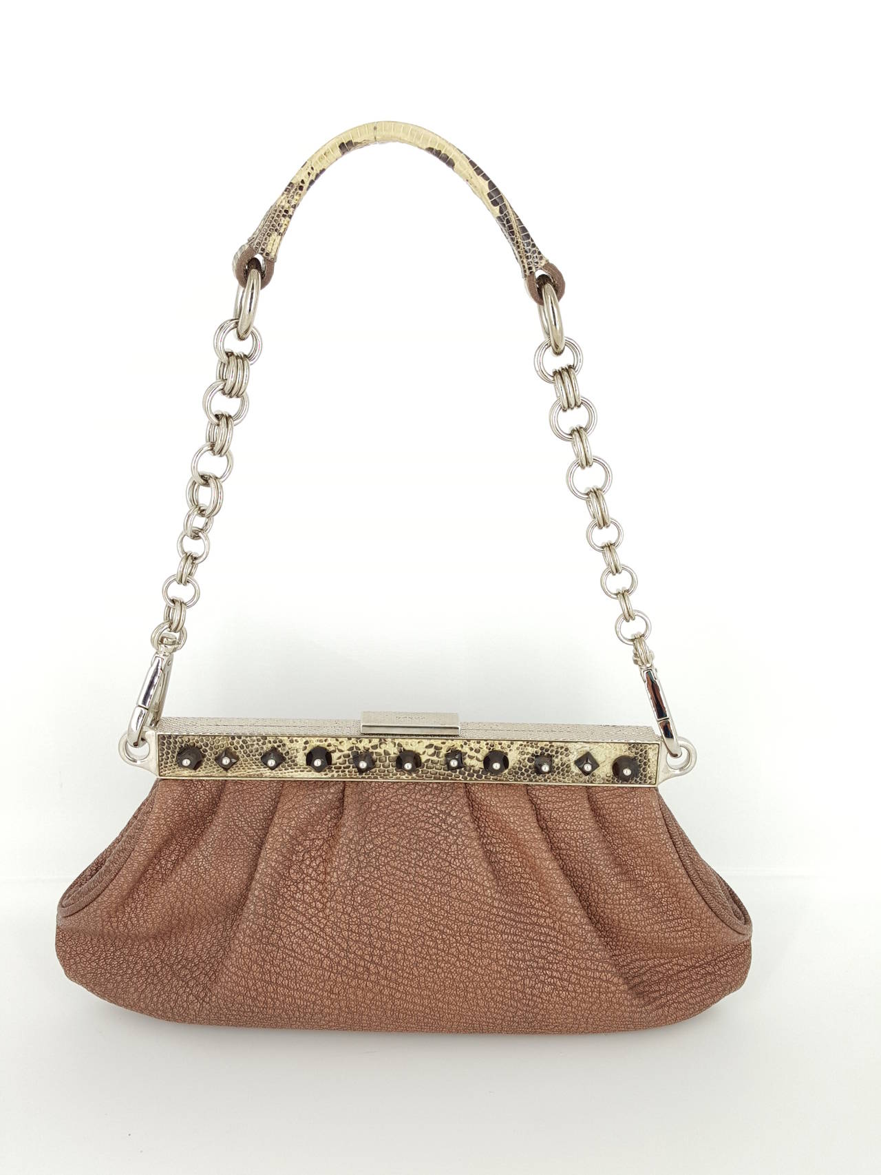 Offered for sale is this stunning Prada Limited Edition Pochette/shoulder bag.
It is brown distressed leather with python trim and strap.  The strap has a wide silver chain and the bag is studded with topaz  crystal studs.  The bag has a rich look