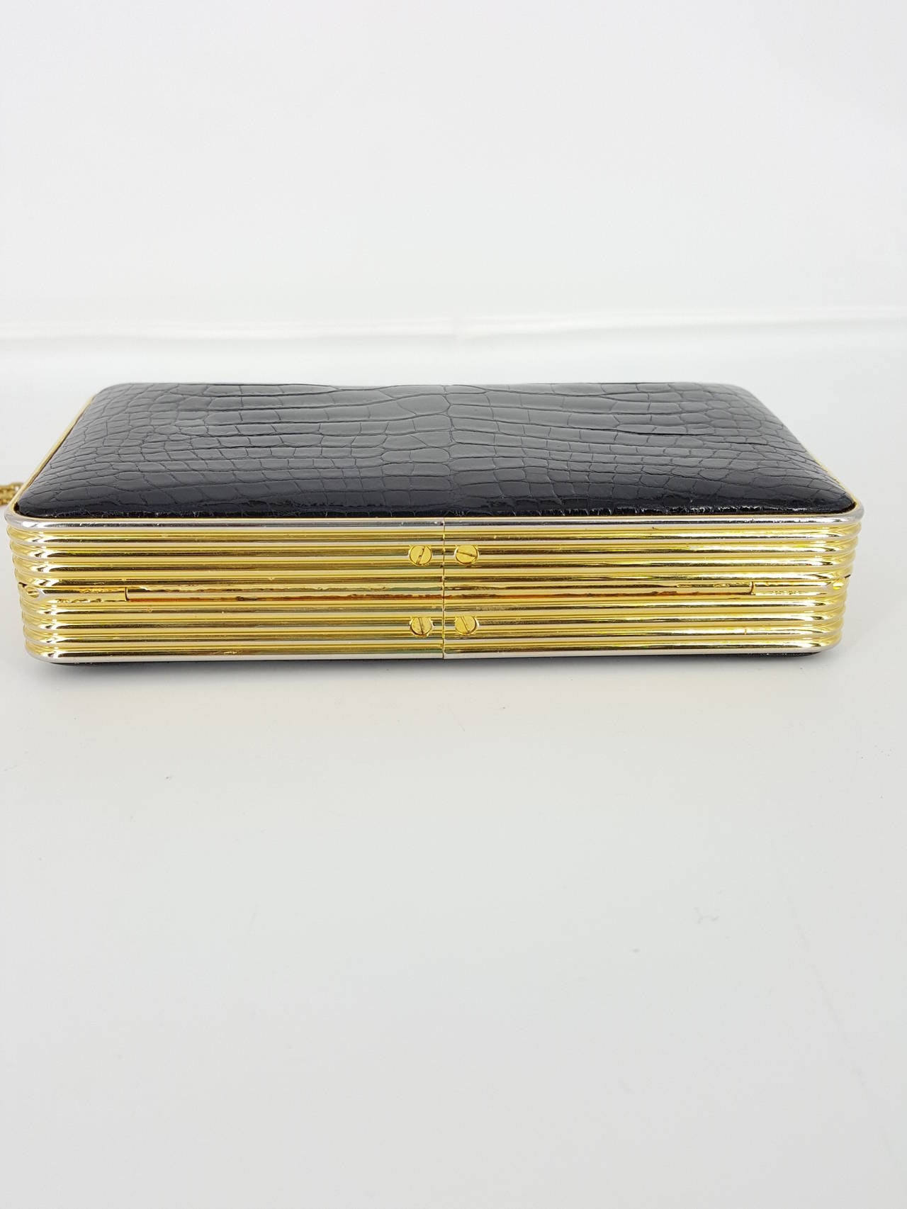 black clutch with gold chain