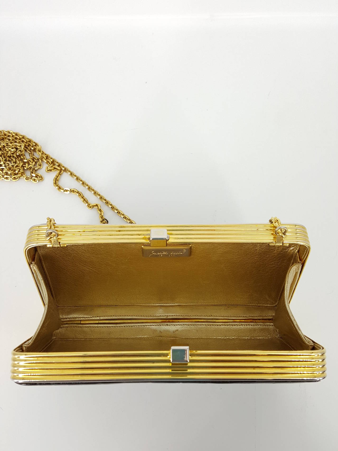 black evening bag with gold chain