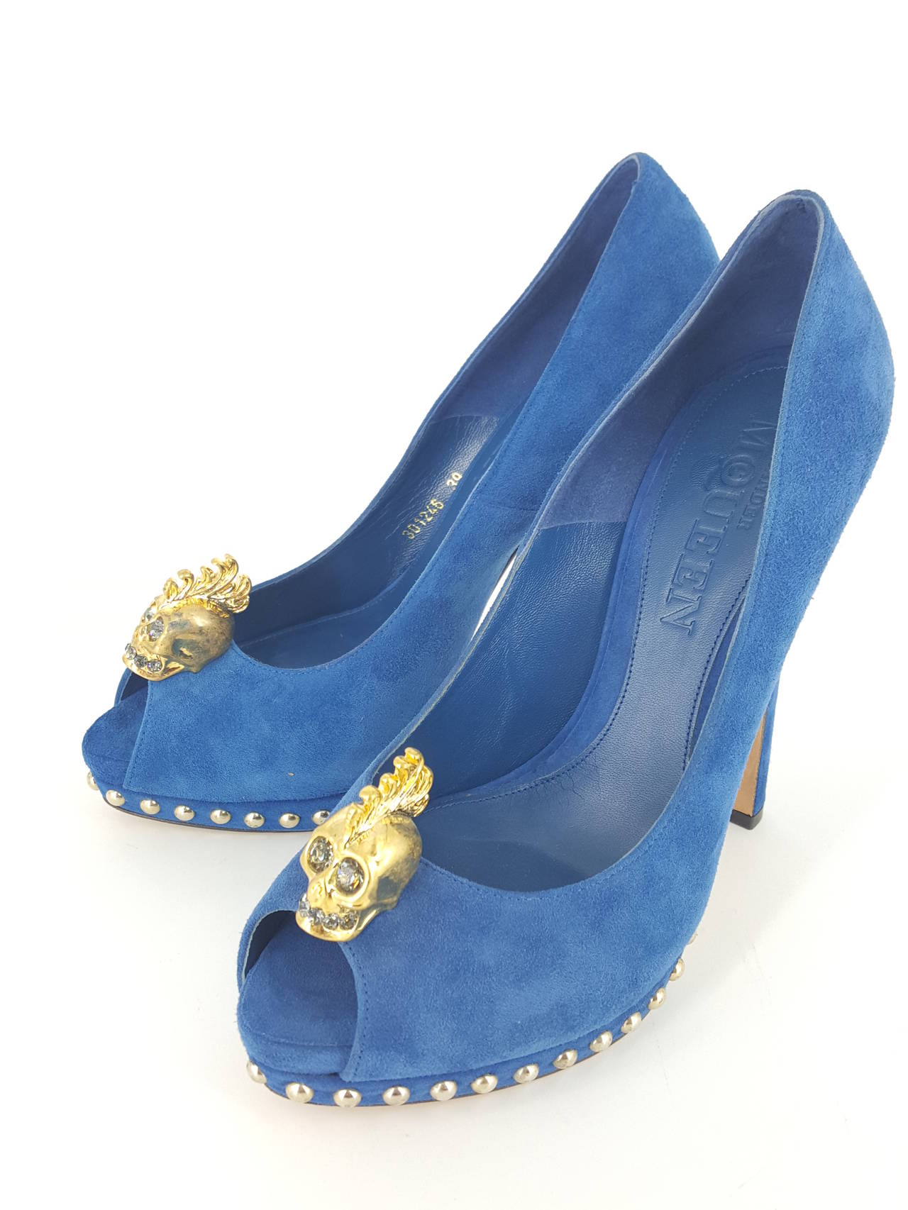 Offered for sale  are these fabulous Cobalt blue suede peep toe Platform pumps by Alexander McQueen in size 39.
These are in a never worn condition and a great look.  The large skull ornament on the toe has crystal eyes and teeth.  A splendid
