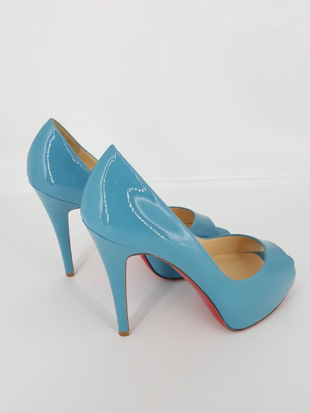 Offered for sale are these Christian Louboutin peep toes pumps in a beautiful turquoise patent leather. These have never been worn.  The turquoise color is outstanding.  They are in size 36 1/2 an the heel height is 4 3/4