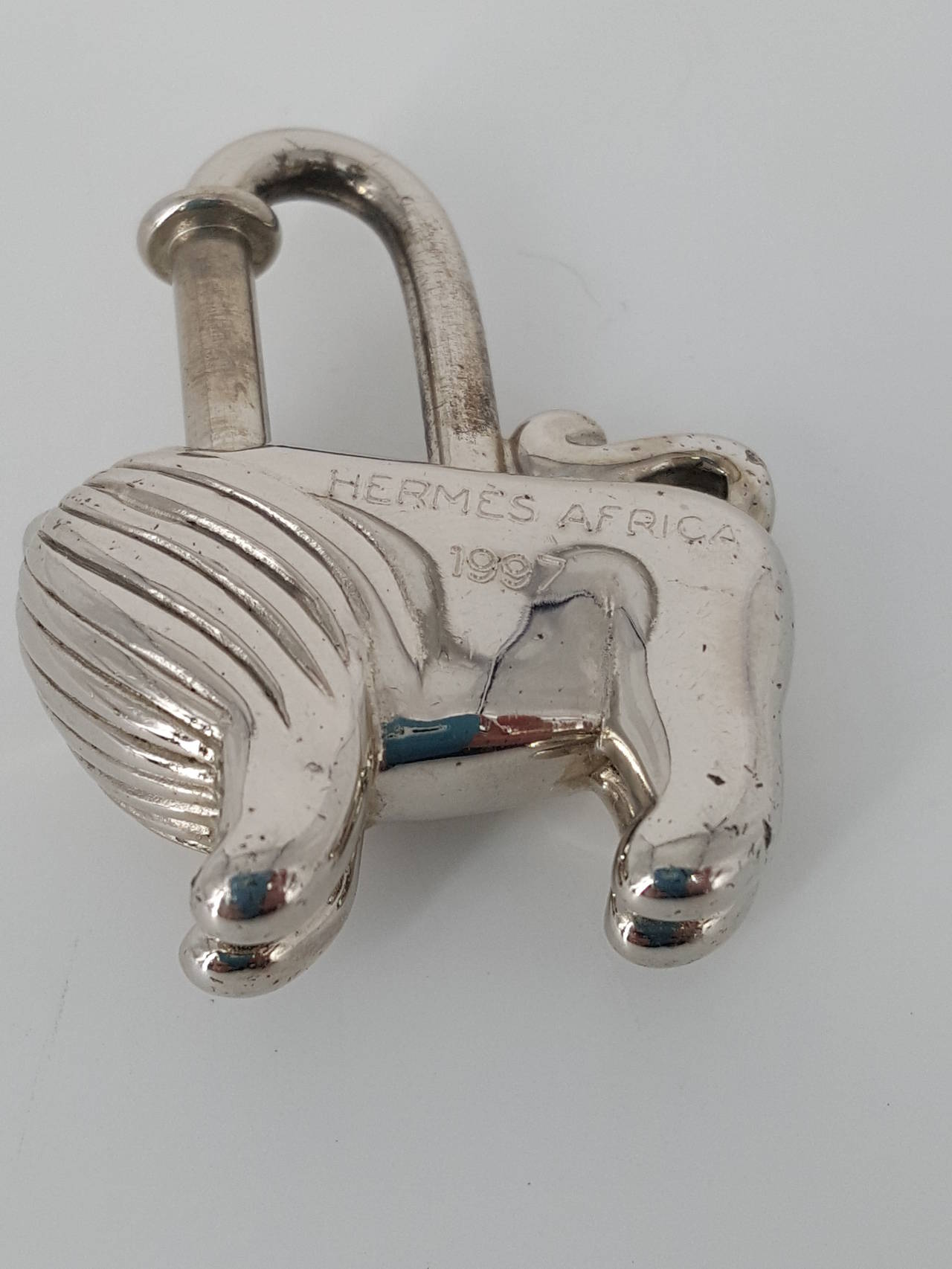 Offered for sale is this Hermes Cadena in a lion motif in palladium finish from 1997.