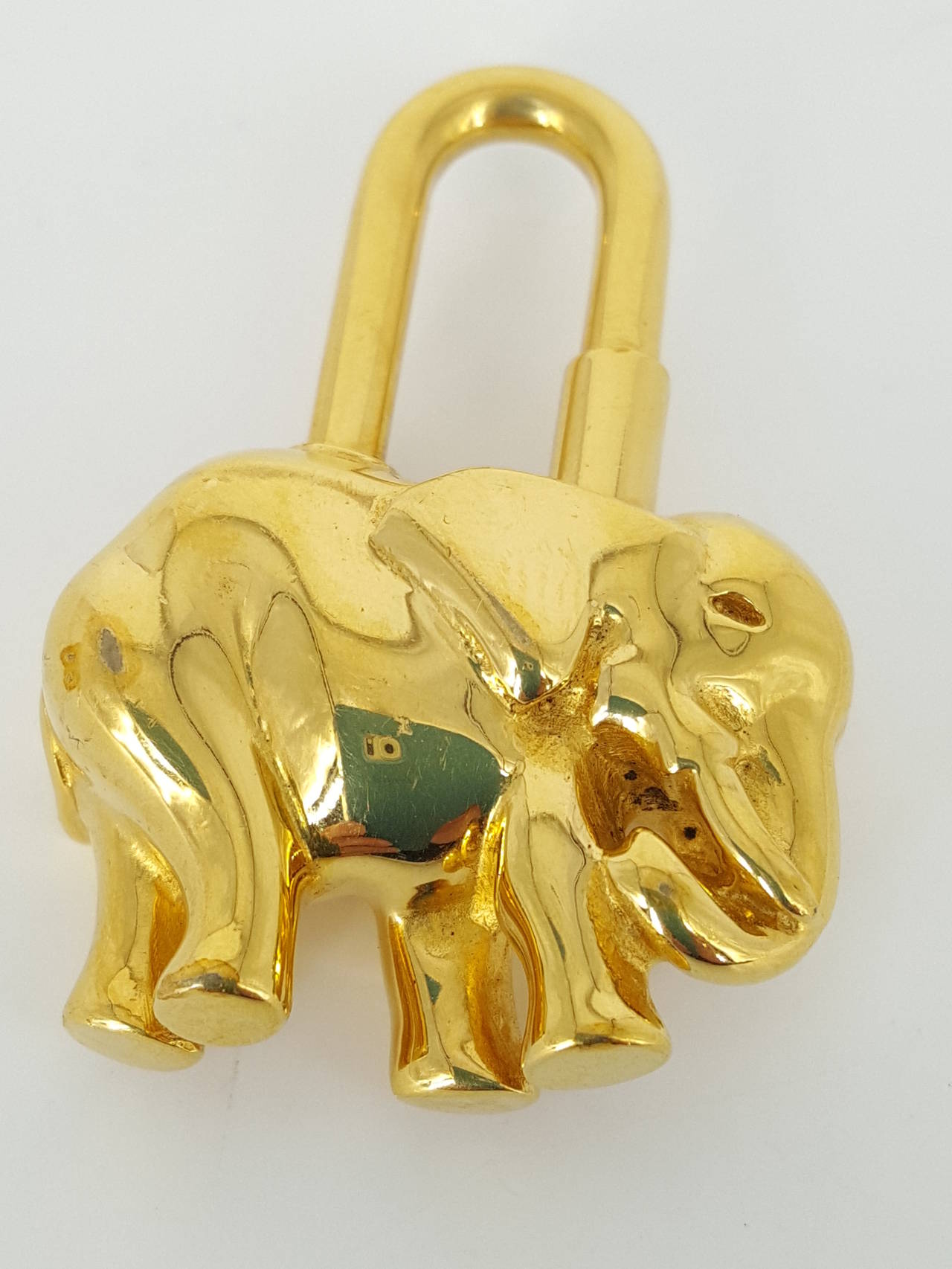 Offered for sale is this Hermes Elephant motif Cadena in gold tone.  It can be a key ring or a charm to adorn your Birkin bag.  Like new condiion.